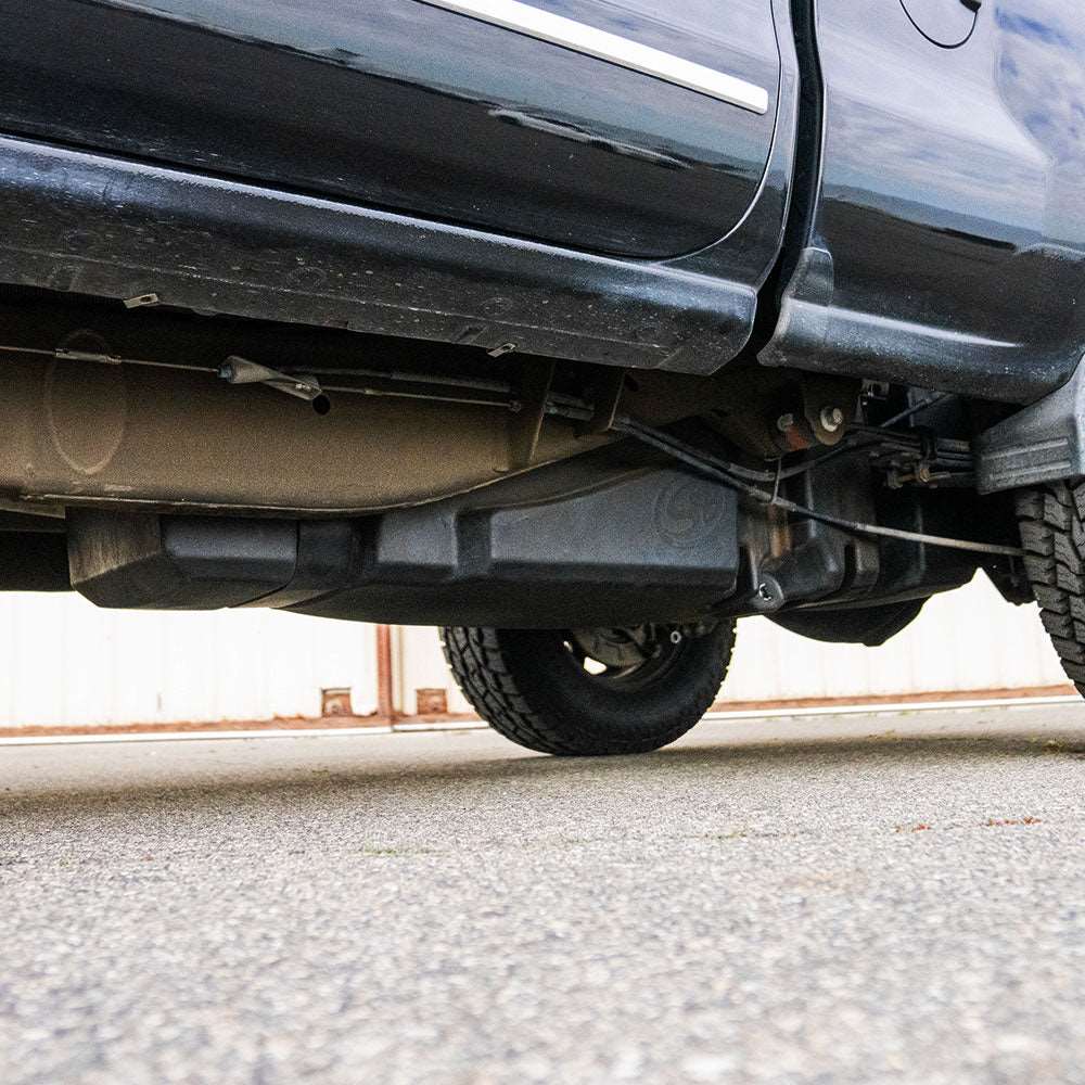 Rear view of a GM Duramax truck showcasing the space for the 62-gallon fuel tank installation
