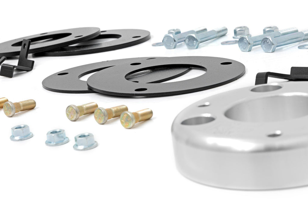 Aluminum spacer parts from a 2-inch lift kit designed specifically for a 2018 or newer Ford Expedition