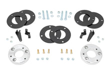 Load image into Gallery viewer, Components of a 2-inch lift kit for a Ford Expedition, including aluminum spacers and installation hardware