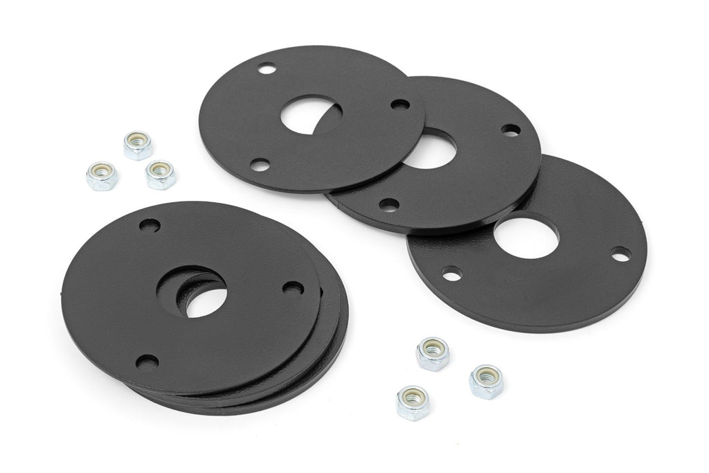 Black leveling spacers and installation hardware for Chevy Colorado