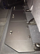 Under-seat area of a Toyota Tundra CrewMax equipped with dual metal lockable storage boxes