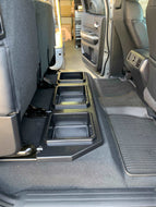 Tundra rear seat organization with twin storage bins for vehicle tools and accessories