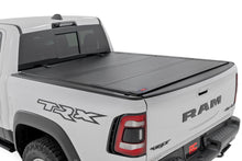 Load image into Gallery viewer, Hard Tri-Fold Flip Up Bed Cover - 5'7 In. - Toyota Tundra (22-23)