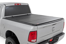 Load image into Gallery viewer, Hard Tri-Fold Flip Up Bed Cover - 5'7 In. Bed - Ram 1500 (09-18)