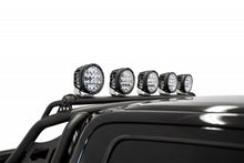 Load image into Gallery viewer, Ford Raptor with roof-mounted LED light bar brackets by Addictive Desert Designs
