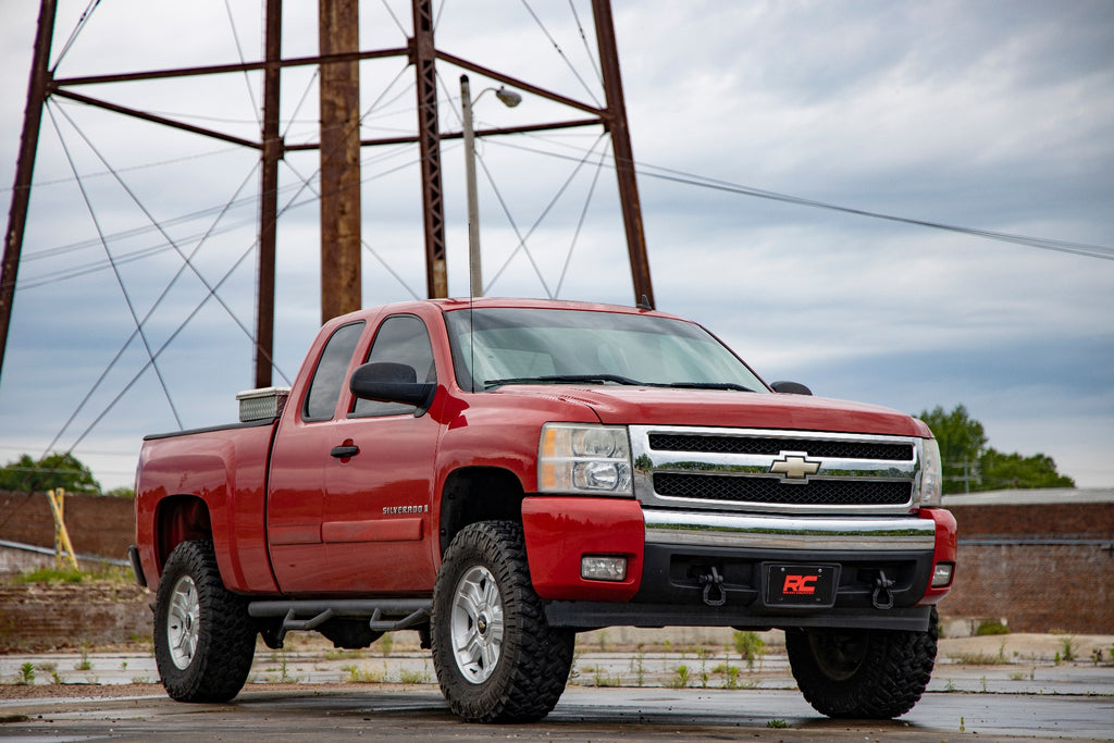 Chevy Silverado equipped with the 5-inch Rough Country lift kit, displayed outdoors