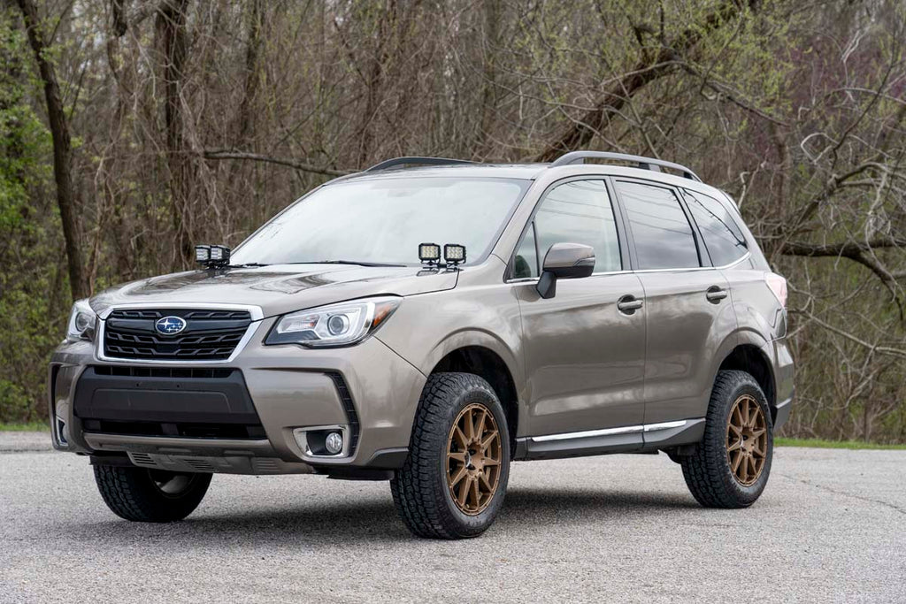 Subaru Forester equipped with a 2-inch Rough Country lift kit parked outdoors