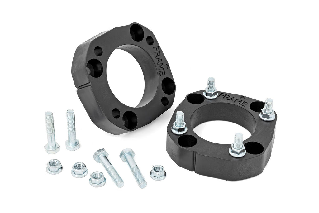 Black wheel spacers and installation hardware for 2023 Toyota Sequoia 4WD leveling kit