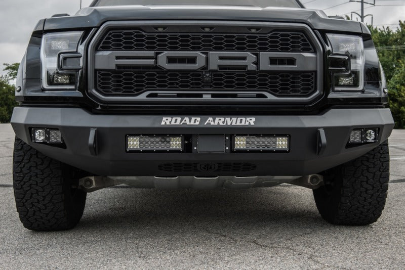 The front of a black Ford Raptor with a Road Armor 17-20 Ford Raptor Stealth Front Non-Winch Bumper - Tex Blk.