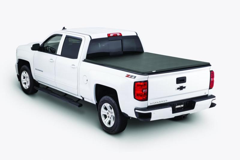 White Chevrolet C10 pickup truck fitted with a black Tonno Pro tri-fold tonneau cover