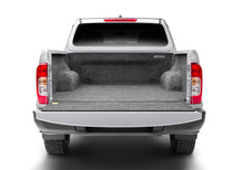 Load image into Gallery viewer, Gray BedRug bedliner fitted in the back of a Nissan truck