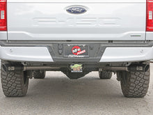 Load image into Gallery viewer, Installation view of aFe Vulcan exhaust on a white Ford F-150's rear
