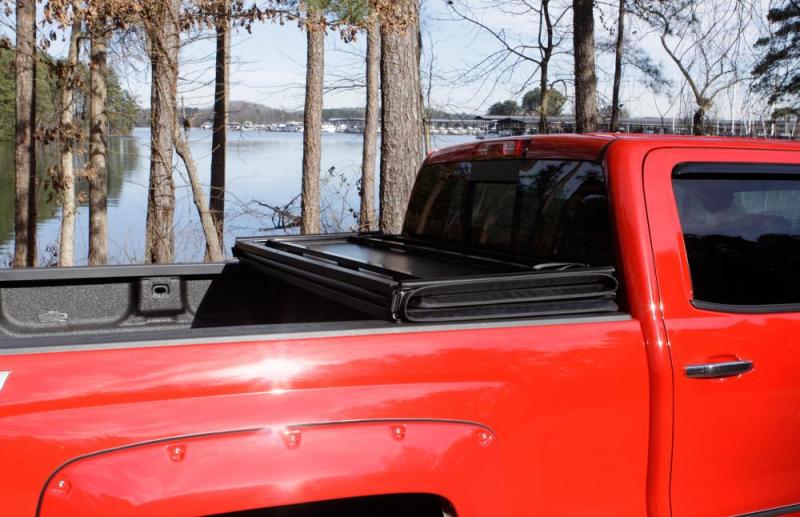 Lund Ford F-150 Styleside (6.5ft. Bed) Hard Fold Tonneau Cover - Black