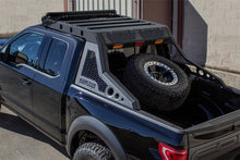 Load image into Gallery viewer, Ford F-150 Raptor's truck bed featuring the HoneyBadger tire rack by Addictive Desert Designs
