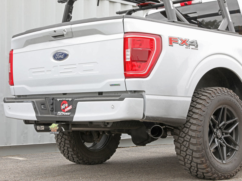 Rear view of a white Ford F-150 fitted with aFe Vulcan cat-back exhaust