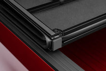 Load image into Gallery viewer, Lund Nissan Frontier Styleside (5ft. Bed) Hard Fold Tonneau Cover - Black