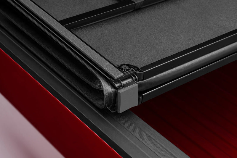 Lund Nissan Titan (5.5ft. Bed) Hard Fold Tonneau Cover w/Bracket Kit - Black