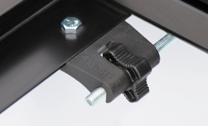 Close-up of the metal clamp from the Access Limited cover kit on a workbench