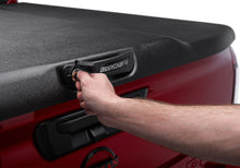 Load image into Gallery viewer, UnderCover Nissan Frontier 5ft Elite Bed Cover - Black Textured