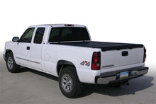 Load image into Gallery viewer, White Chevy/GMC truck equipped with the Access Tonnosport black roll-up cover