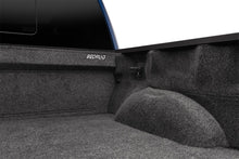Load image into Gallery viewer, Nissan truck bed enhanced with a gray BedRug carpet liner