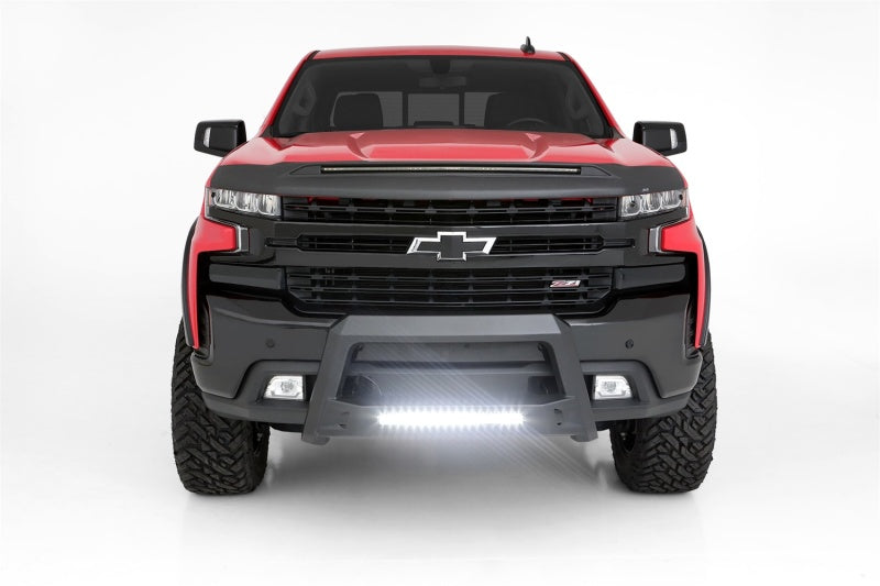 Lund Revolution Bull Bar installed on a red Chevrolet Silverado 1500