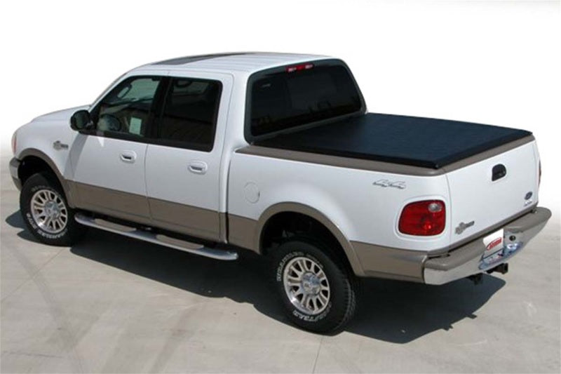 Ford F-150 Flareside truck equipped with a black Access Original roll-up bed cover