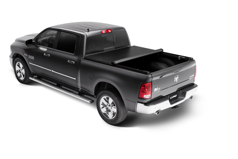 Black Dodge Dakota showcasing the Lund Genesis roll-up tonneau cover