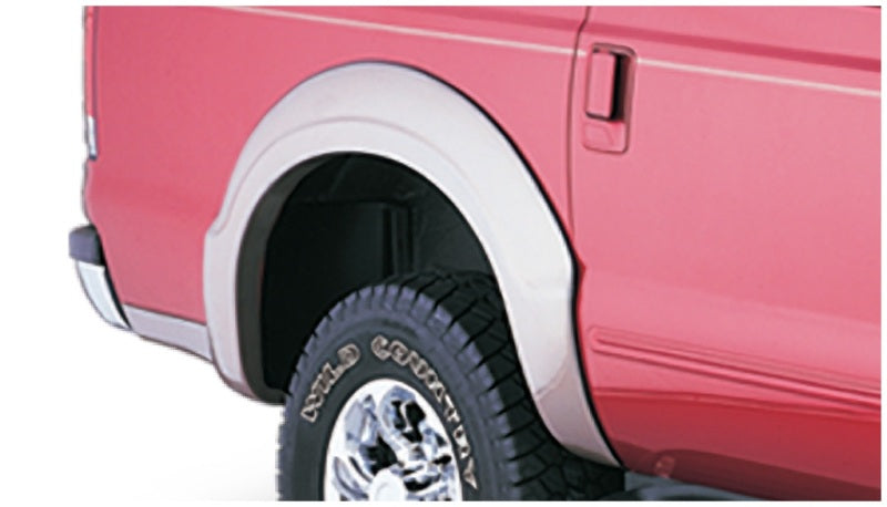 Black fender flares designed for a Ford Excursion by Bushwacker