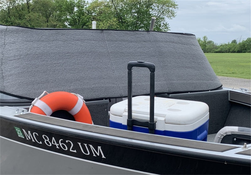 Boat accessories including a cooler and life jacket with the Truxedo Protector in view