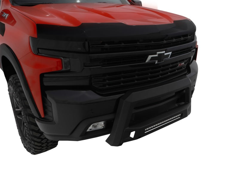 Front view of a red Chevrolet Silverado equipped with Lund Revolution Bull Bar