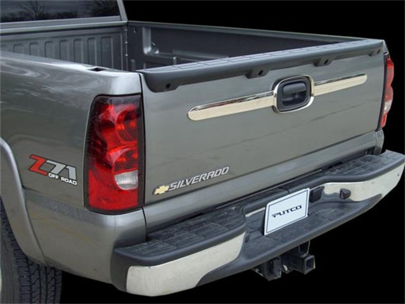 Detailed image of the Putco tailgate accents installed on a Chevy Silverado