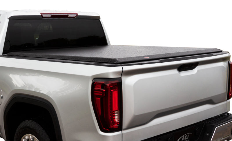 Rear angle view of a white truck fitted with the Access Original bed cover