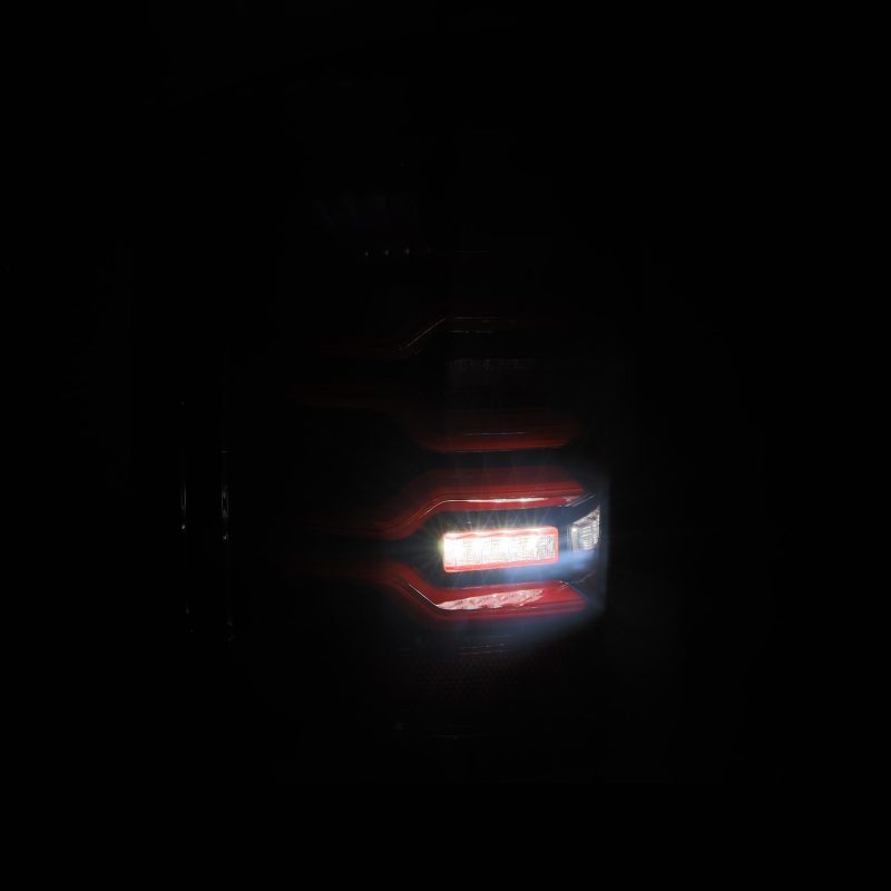 AlphaRex 14-19 Chevy Silverado 1500 Luxx-Series LED Tail Lights Black/Red w/Activ Light/Seq Signal