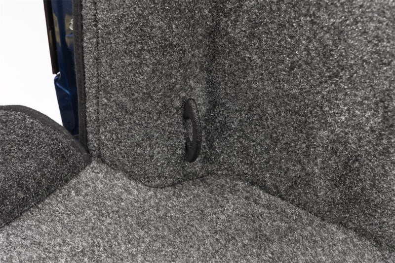 Nissan vehicle's bed with a blue and gray BedRug liner installed